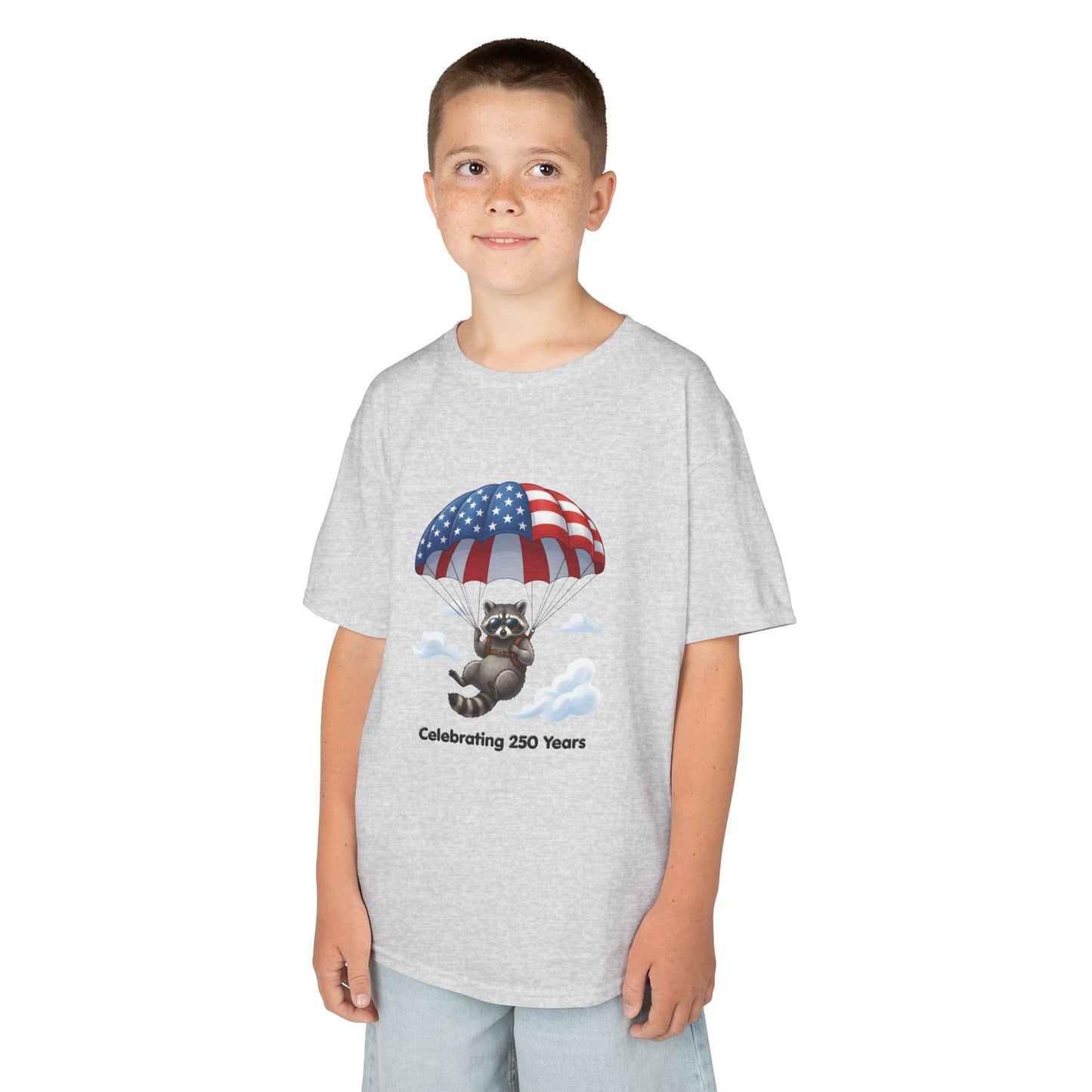 Kids T-Shirt — Patriotic Raccoon Parachute “Celebrating 250 Years”